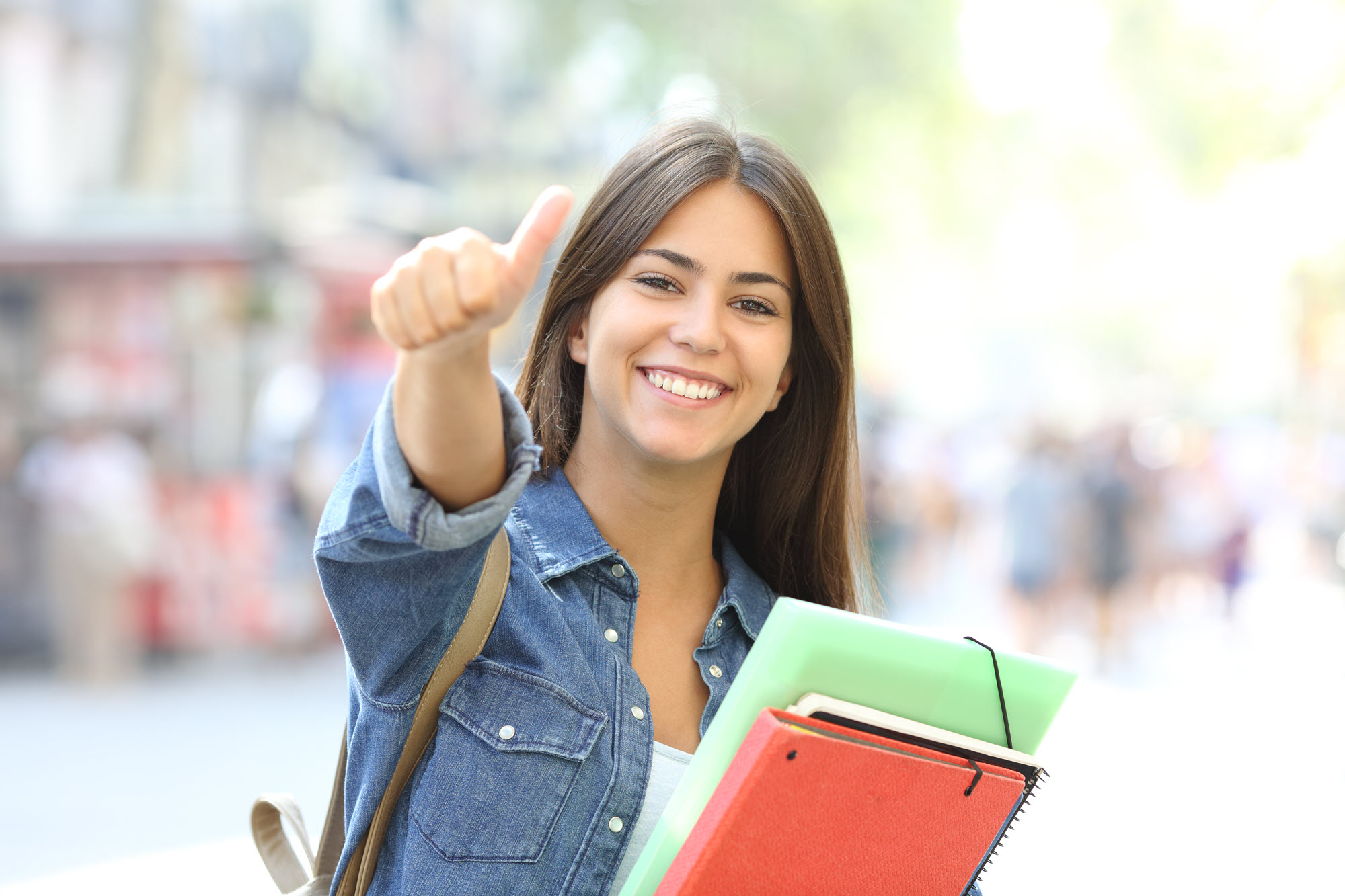 female student thumbs up