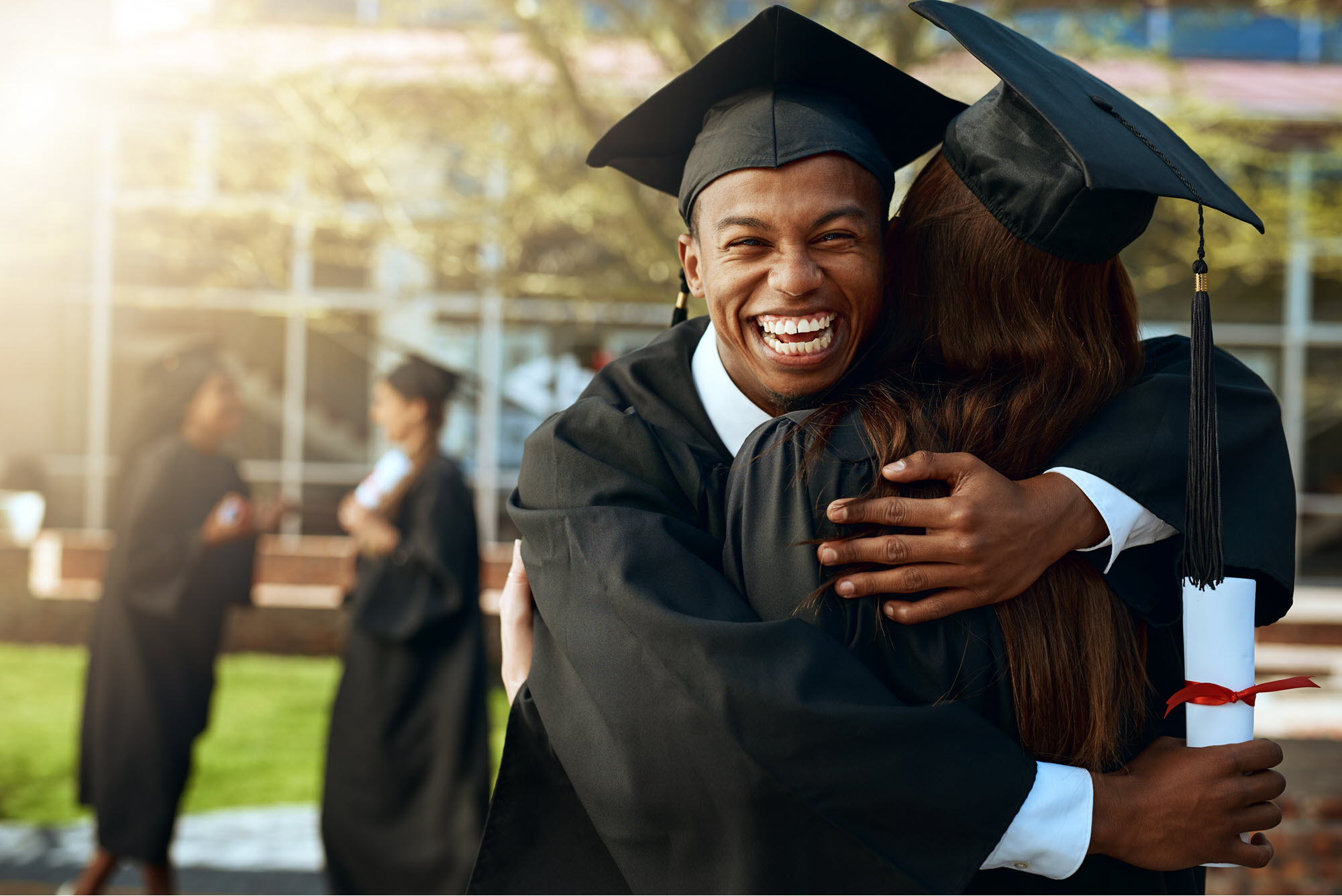 smiling male high school graduate