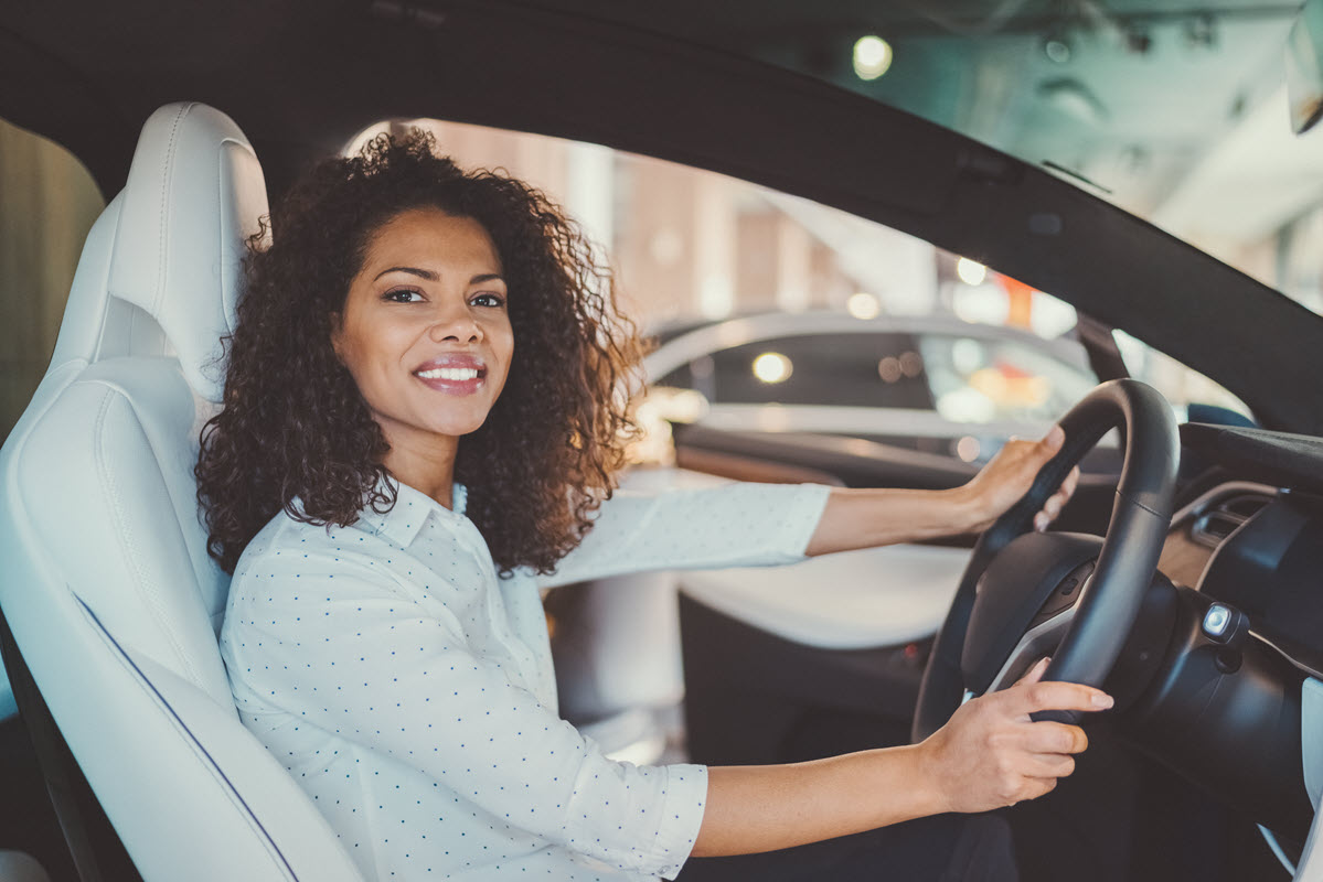 smiling woman driving