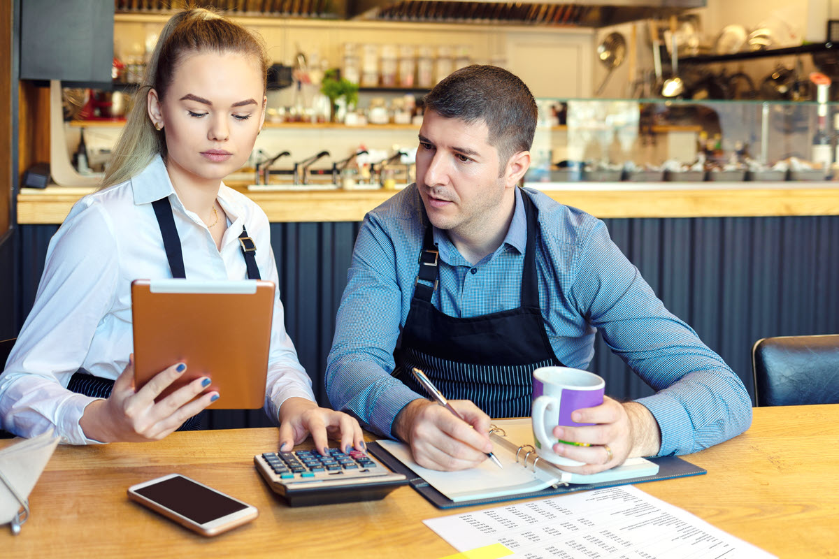 cafe owners working on notes and bookkeeping