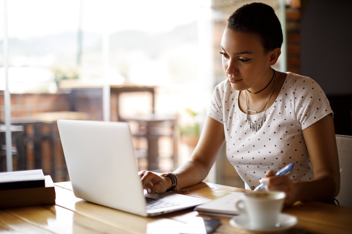 woman doing bills on a computer