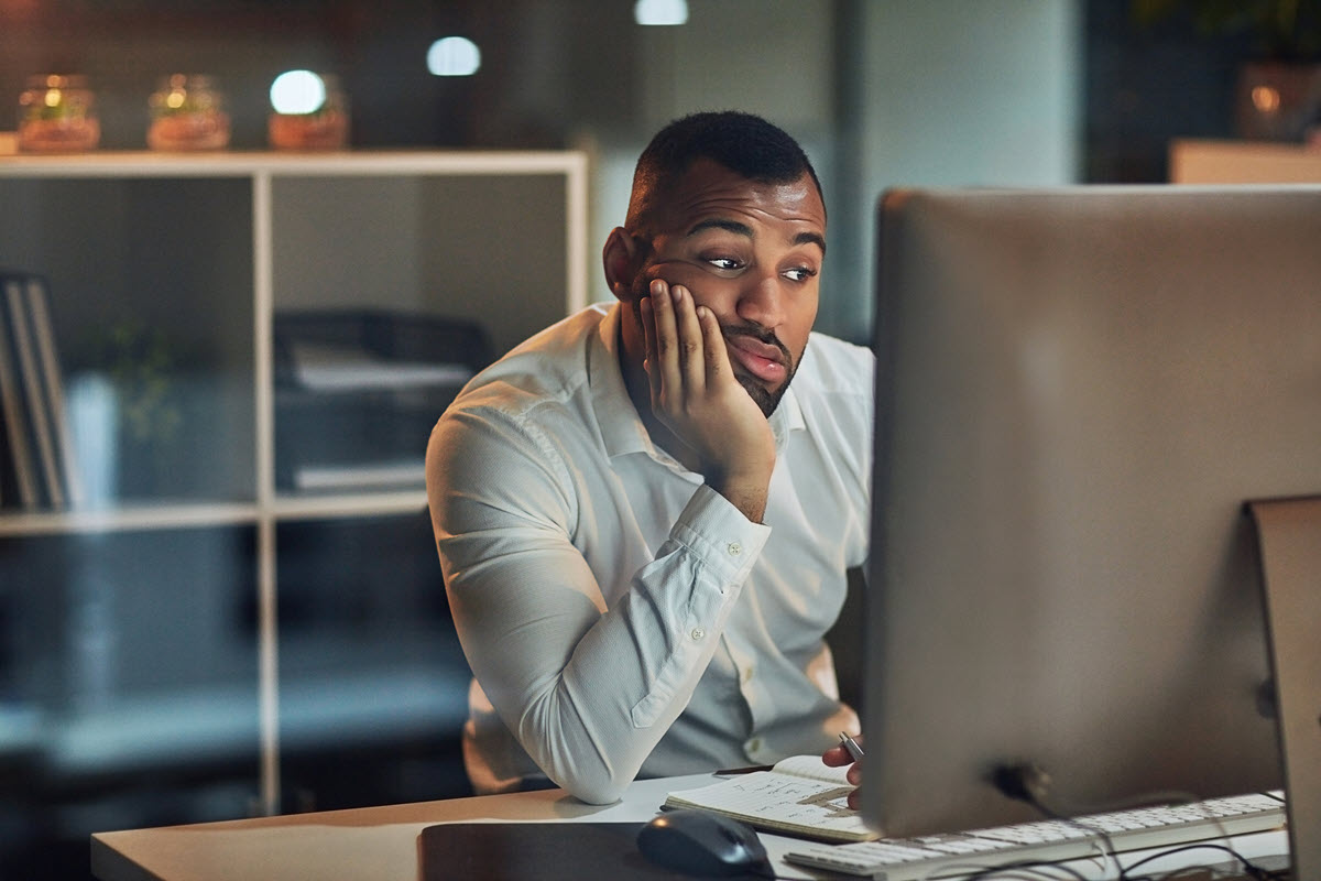 concerned man in front of computer