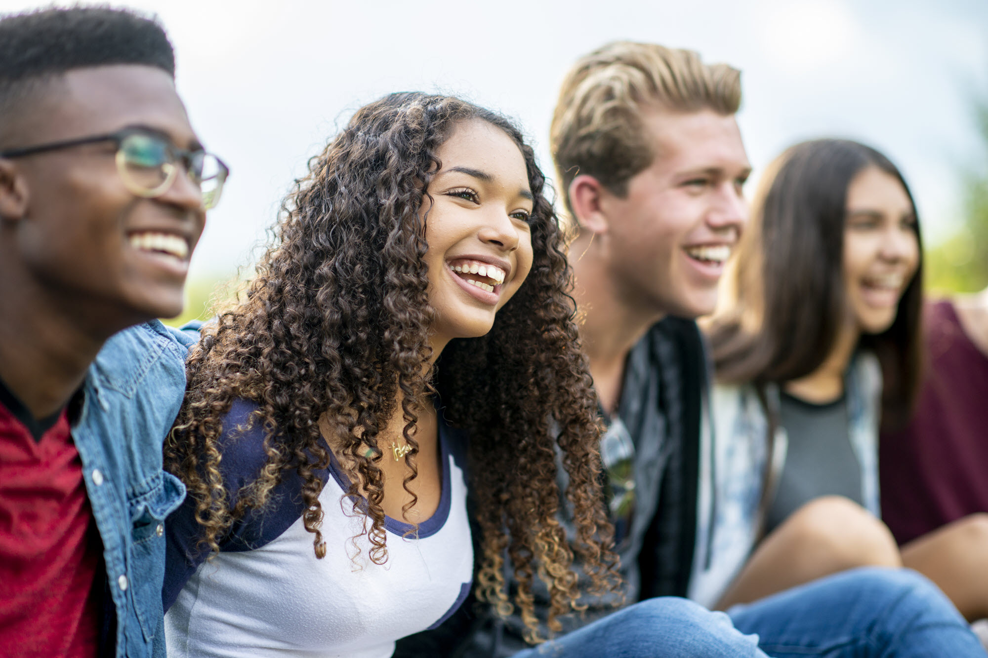 millennial kids sitting and smiling